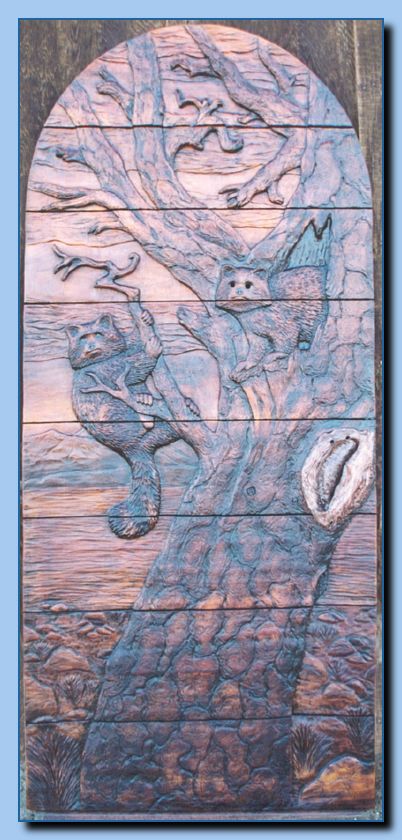 2-11 raccoon in carved door-archive